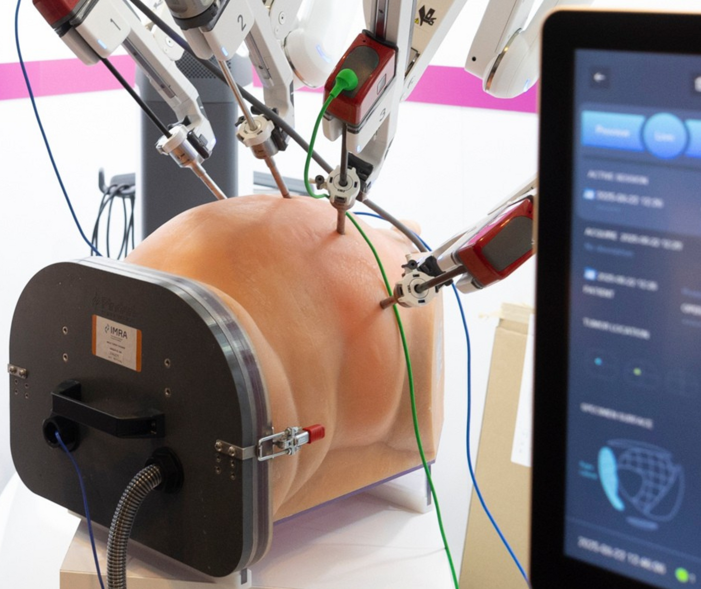 Robotic arm interacting with a human-like torso model on a white background